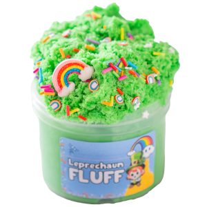 A translucent jar is over filled and piled high with a bright green fluffy cloud slime topped with a rainbow charm and rainbow sprinkles. A blue label on the jar has an image of a leprechaun and a rainbow and reads, Leprechaun Fluff Slime.