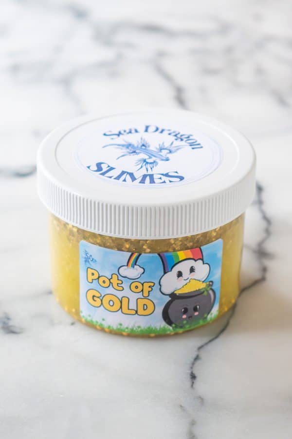 A jar of gold slime, called Pot of Gold, with gold bingsu beads that floated to the top, and gold pearl beads that sank to the bottom.